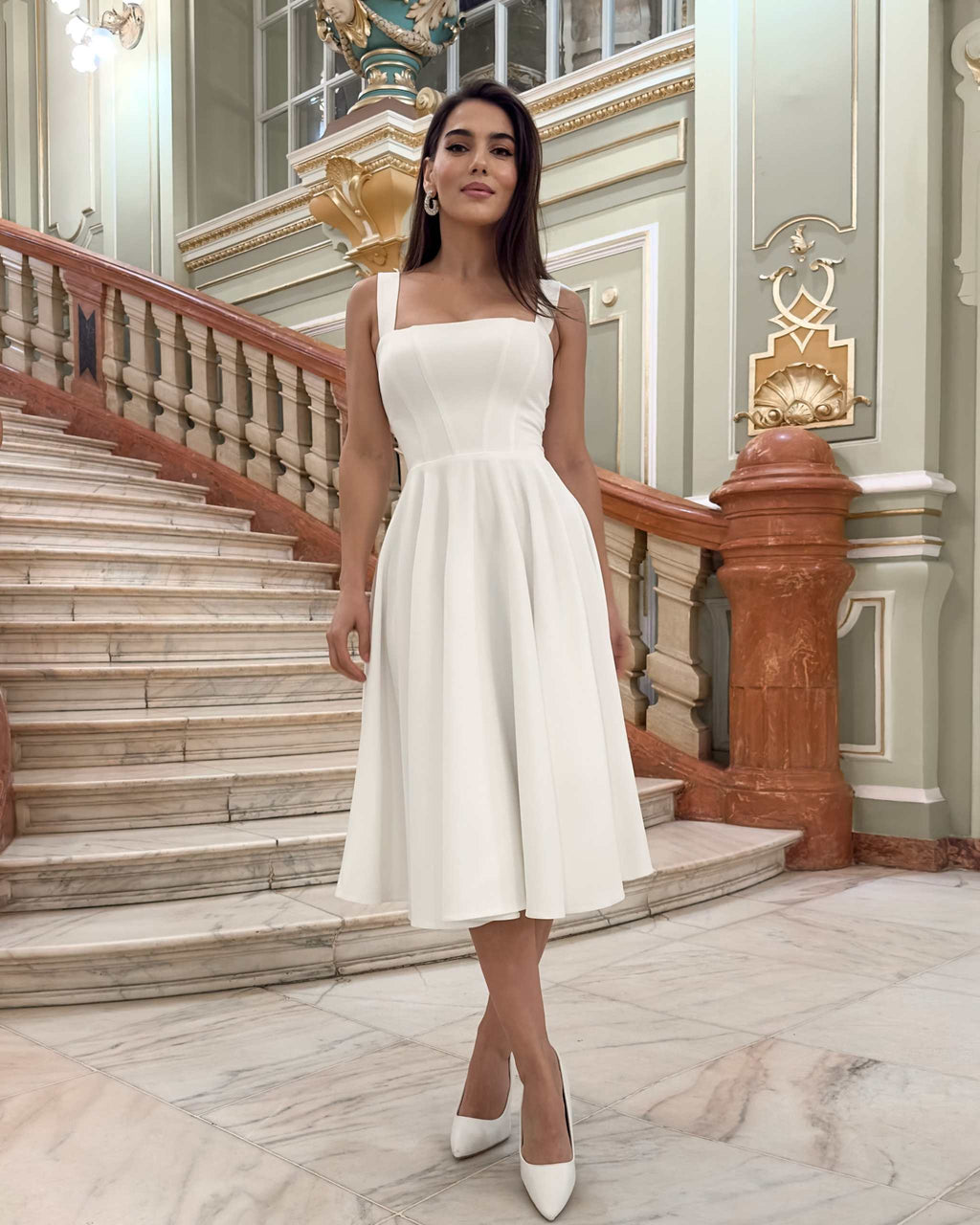 Rochie eleganta de ocazie alba midi croiala A-line confectionata din material barbie premium cu decolteu patrat si bretele late perfecta pentru cununie botez si petreceri elegante