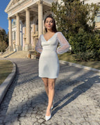Short white dress made of stretch taffeta, with V neckline