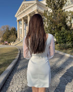 Short white dress made of stretch taffeta, with V neckline