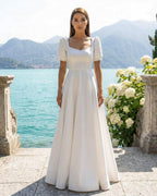 Simple and elegant wedding dress with sleeves