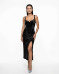Black velvet bodycon dress with straps, slit, and elegant neckline