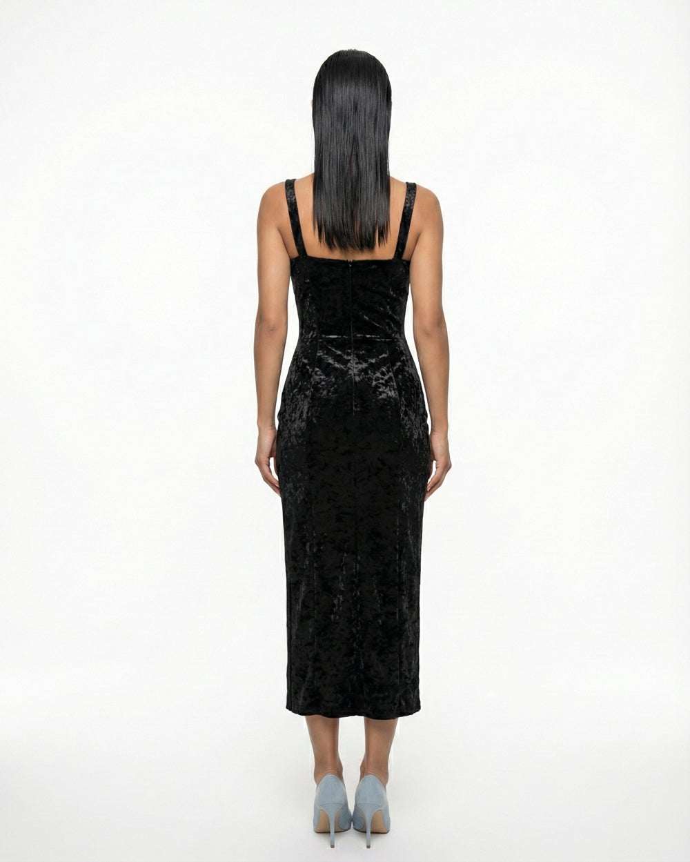 Black velvet bodycon dress with straps, slit, and elegant neckline